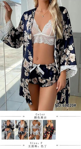 Three-piece luxury lounge and sleepwear set crafted from a botanical silk-satin fabric in a deep navy blue color palette.